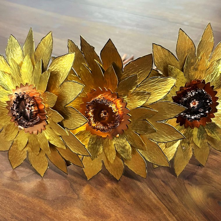large metal sunflowers made of brass and copper