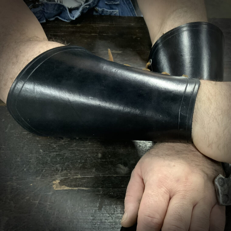 black leather arm bracers